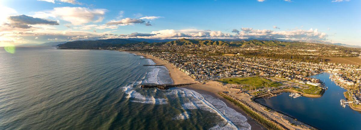 Beachfront lawn and harbor entrance at Marina Park in Ventura